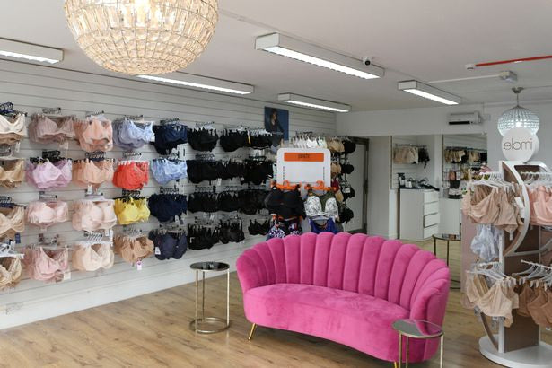 Inside Pretty Woman Bras shop with the pink settee